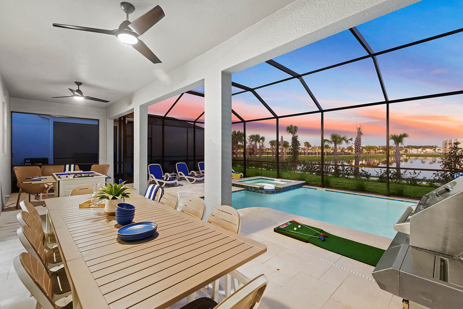 pool and spa with outdoor dining table