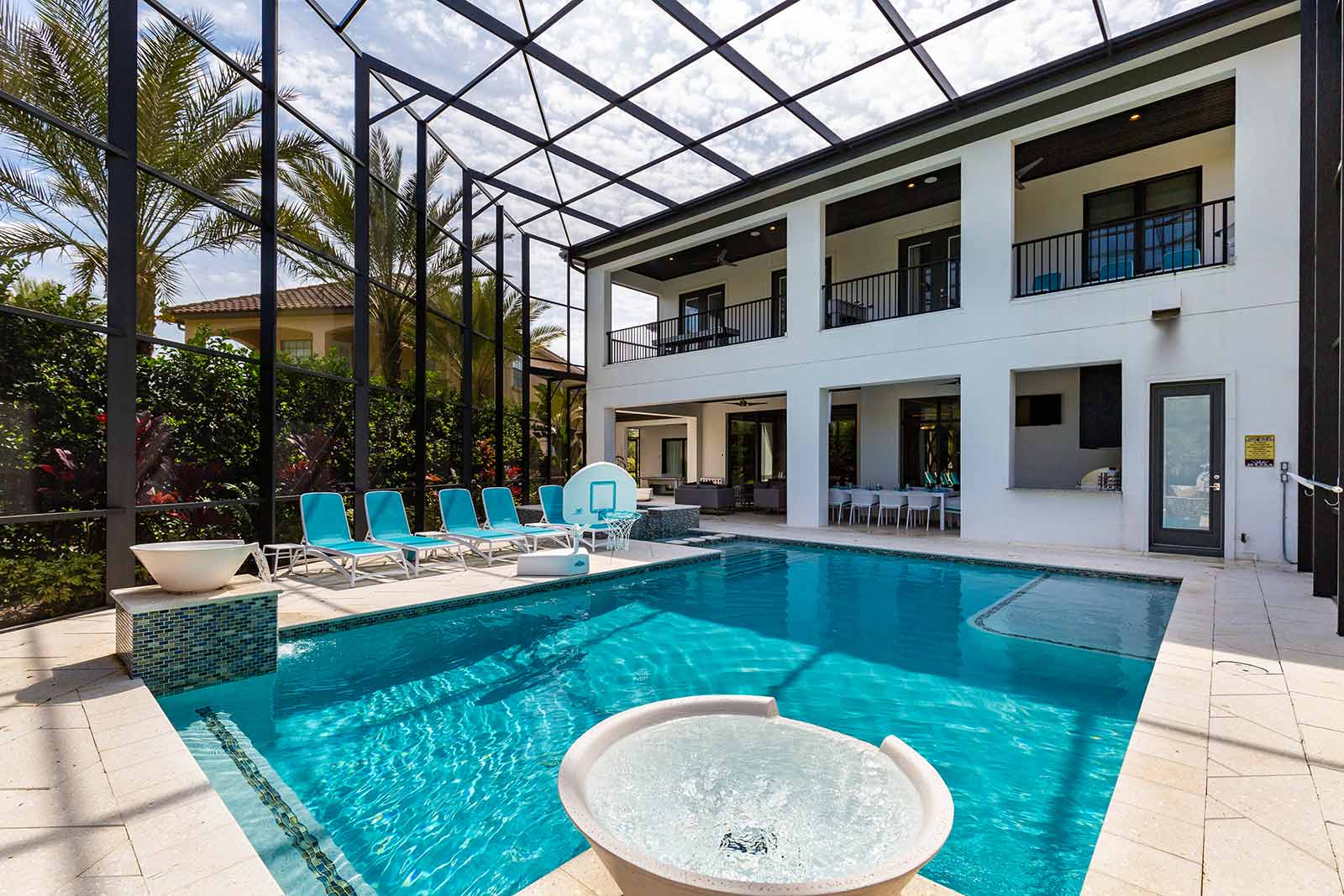 pool and patio with lounge chairs