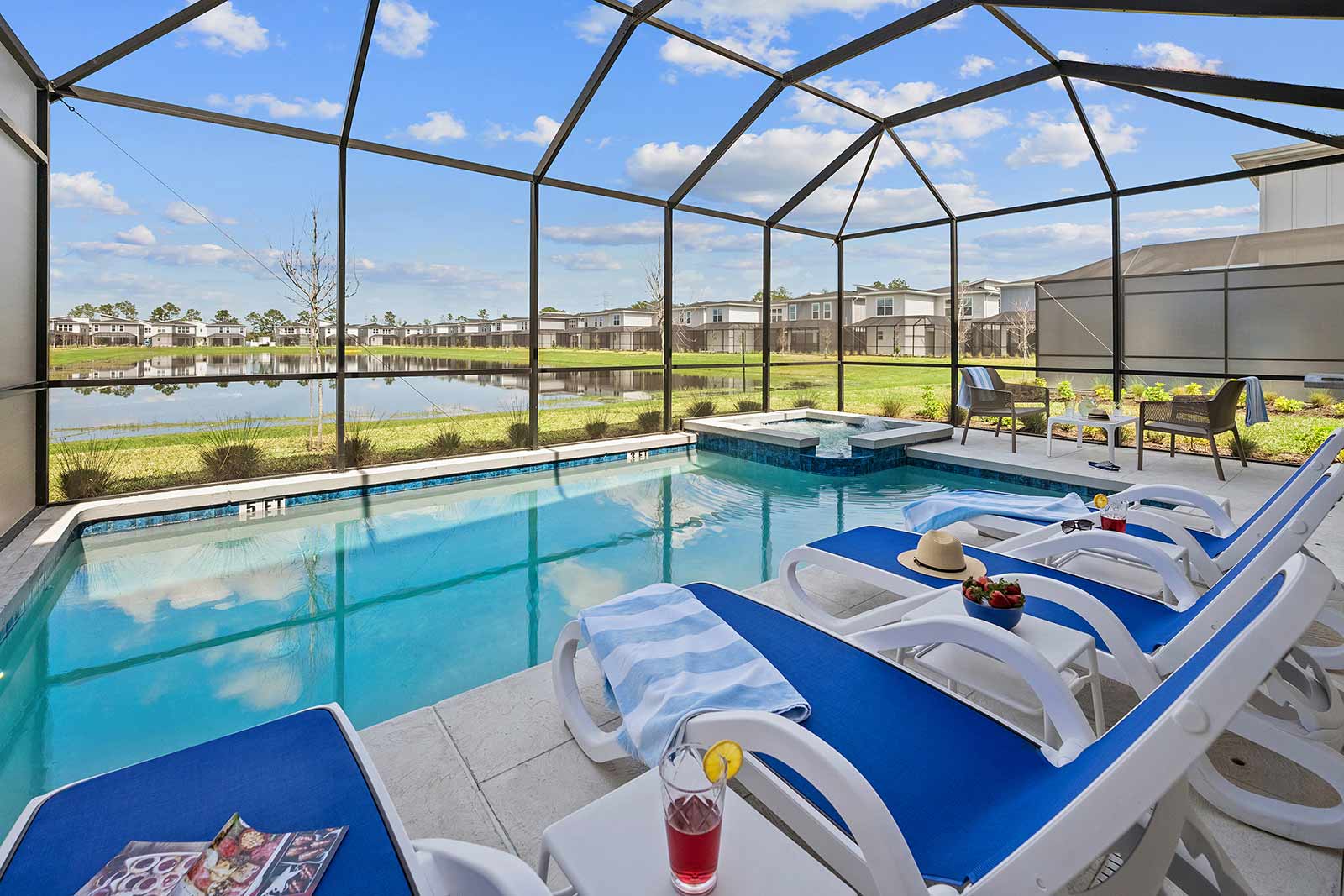 pool and spa with lounge chairs and drinks