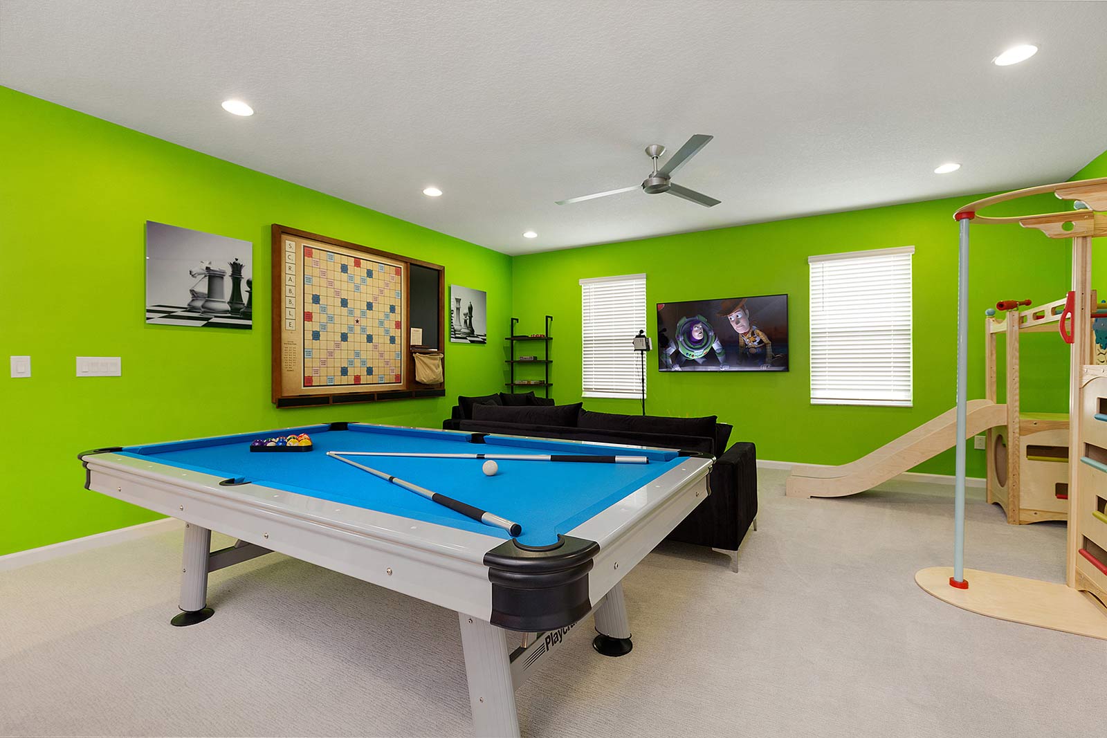 game loft with pool table and wall scrabble