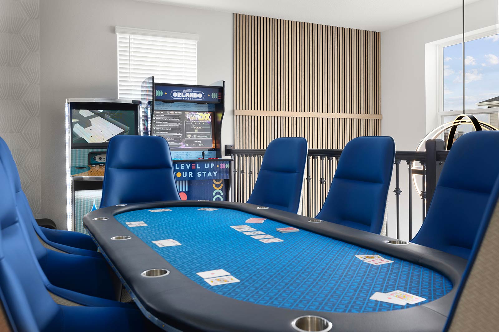 poker table in game loft next to arcade games
