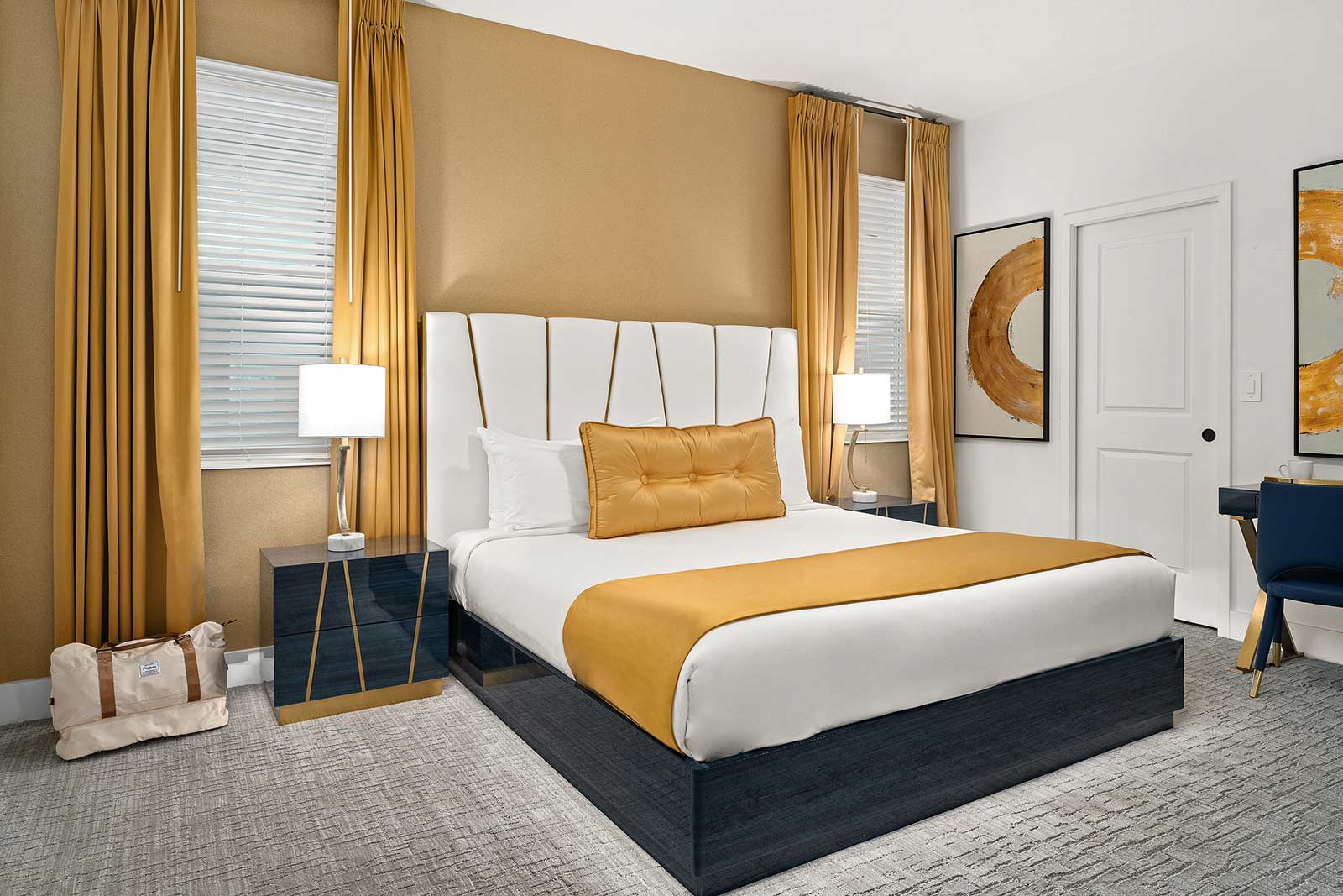 bedroom with king bed with gold wall