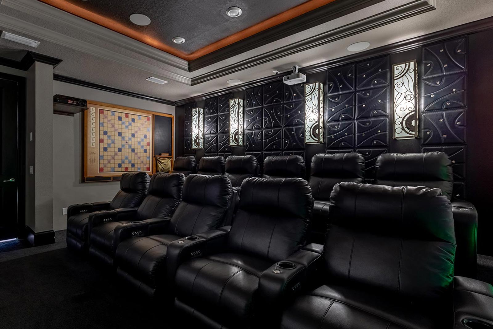 theater with 2 rows of seating and wall scrabble