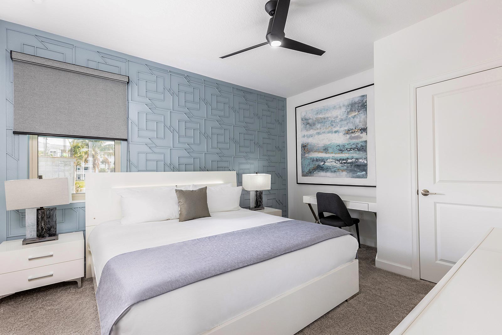 bedroom with king bed and work desk