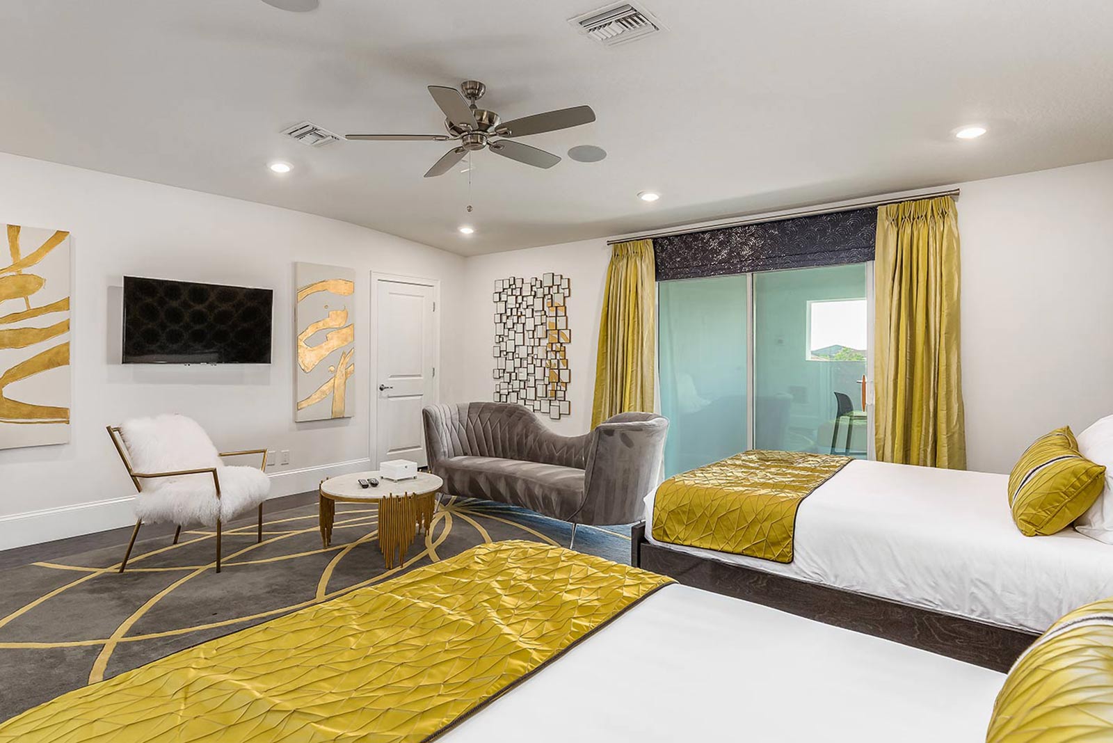 double queen room with gold pillows and gold curtains