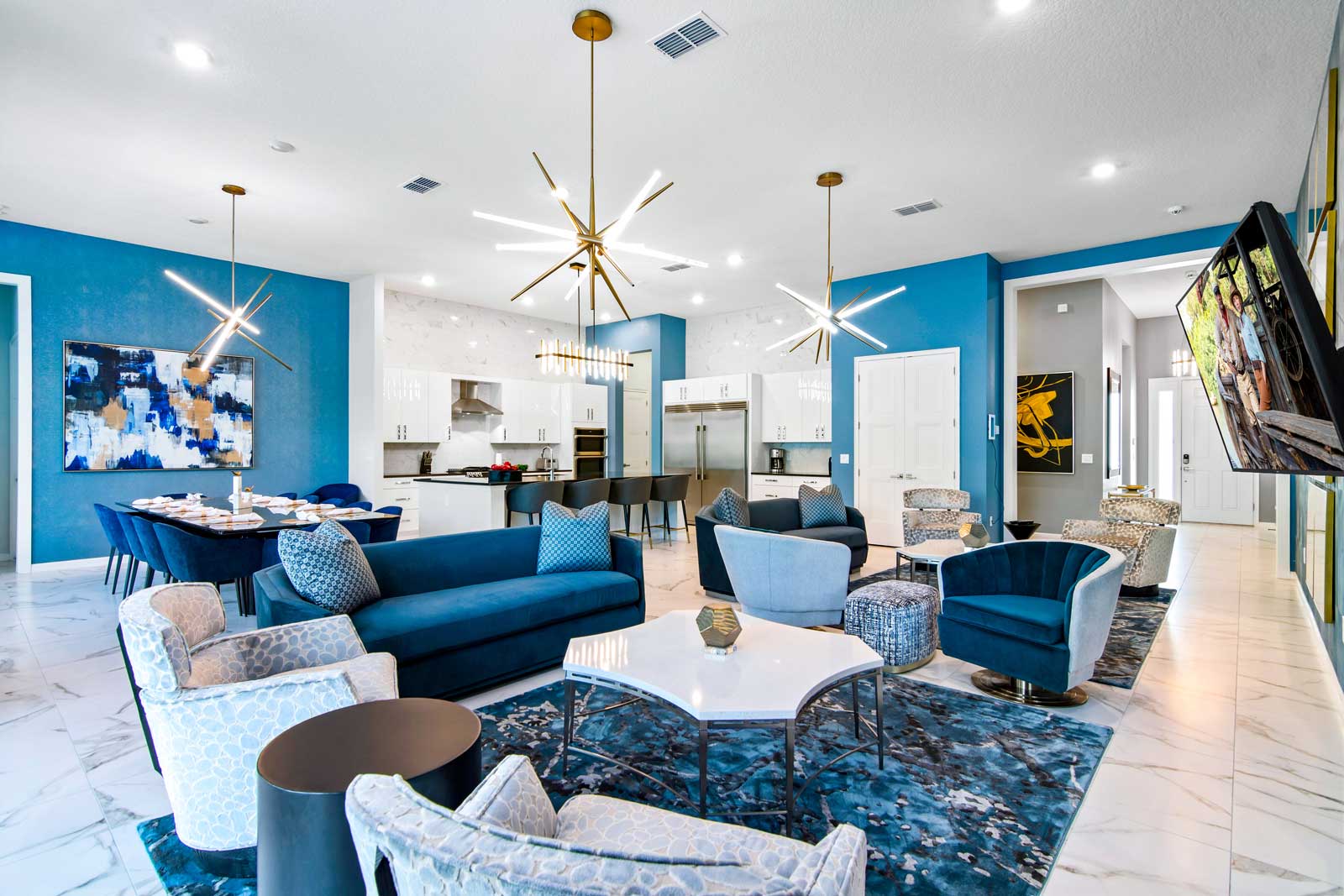 living room with blue couches and chairs