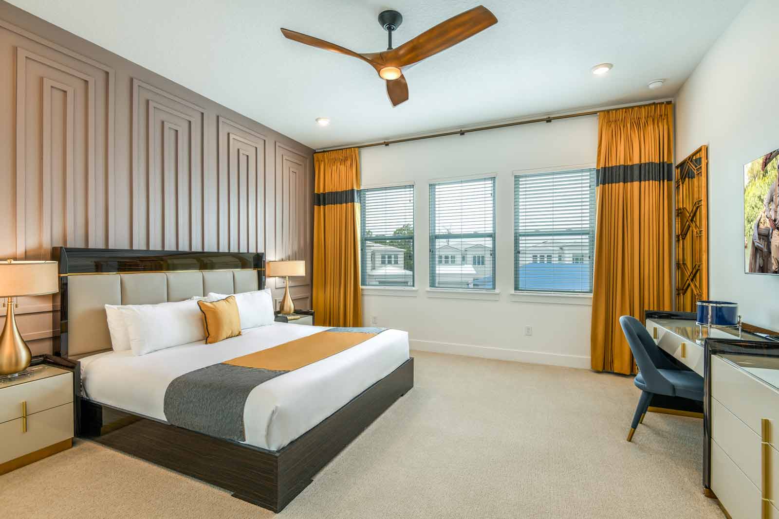 king bedroom with gold curtains