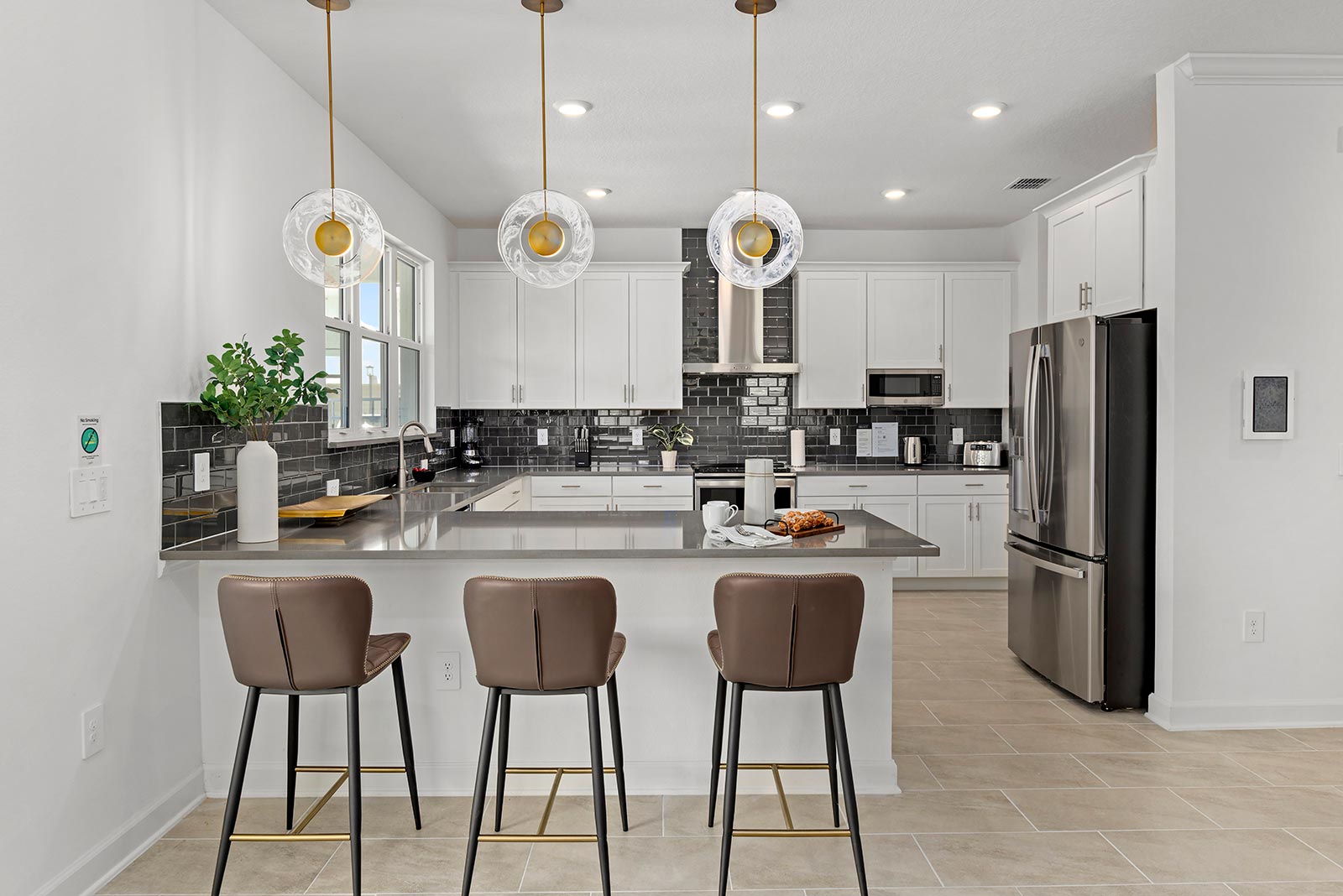 kitchen with breakfast bar and 3 stools