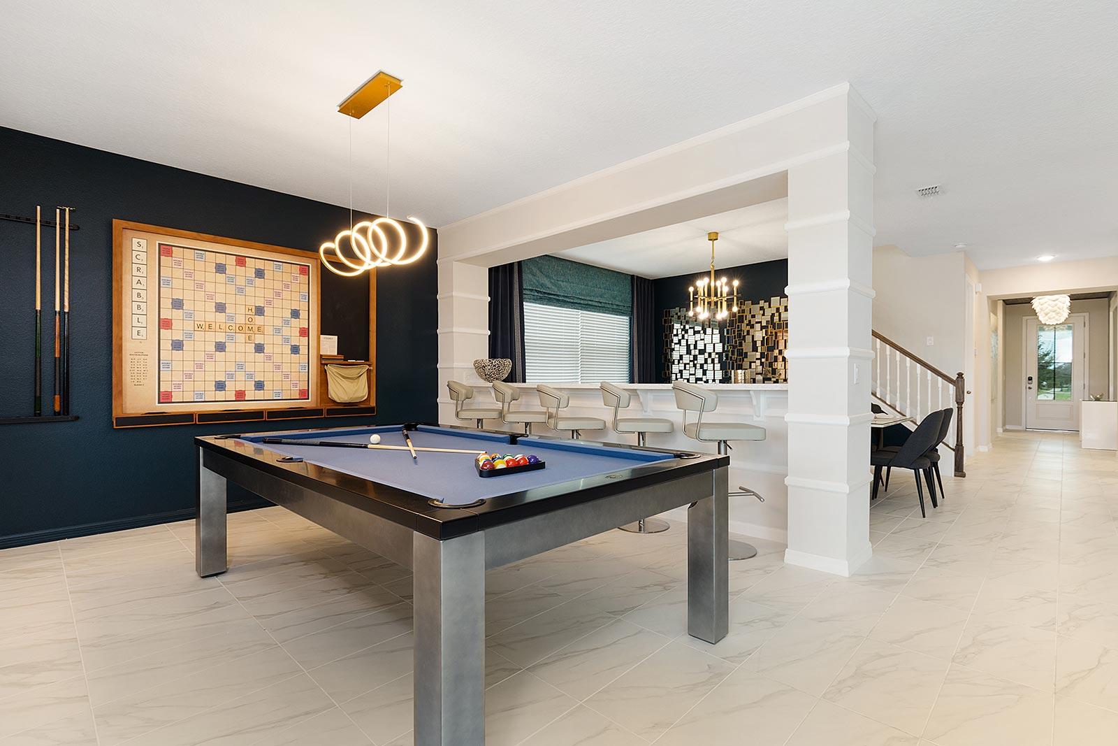 pool table and wall scrabble next to dining room