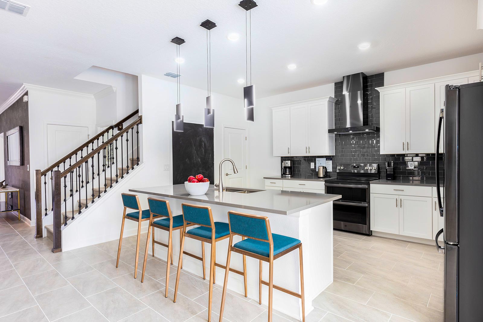kitchen with island and 4 stools