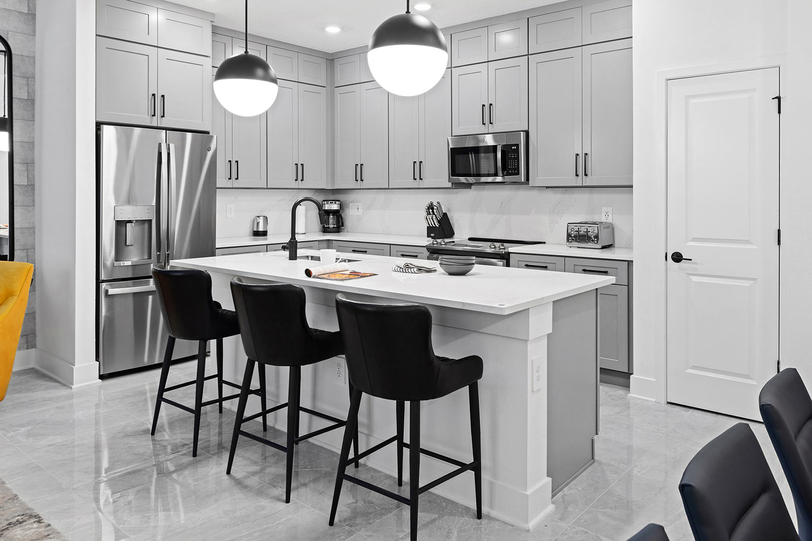 kitchen with island and 3 stools