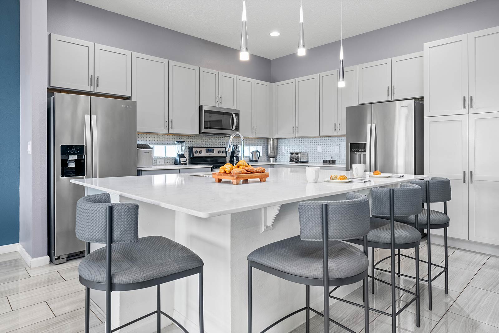 kitchen and island with 4 stools