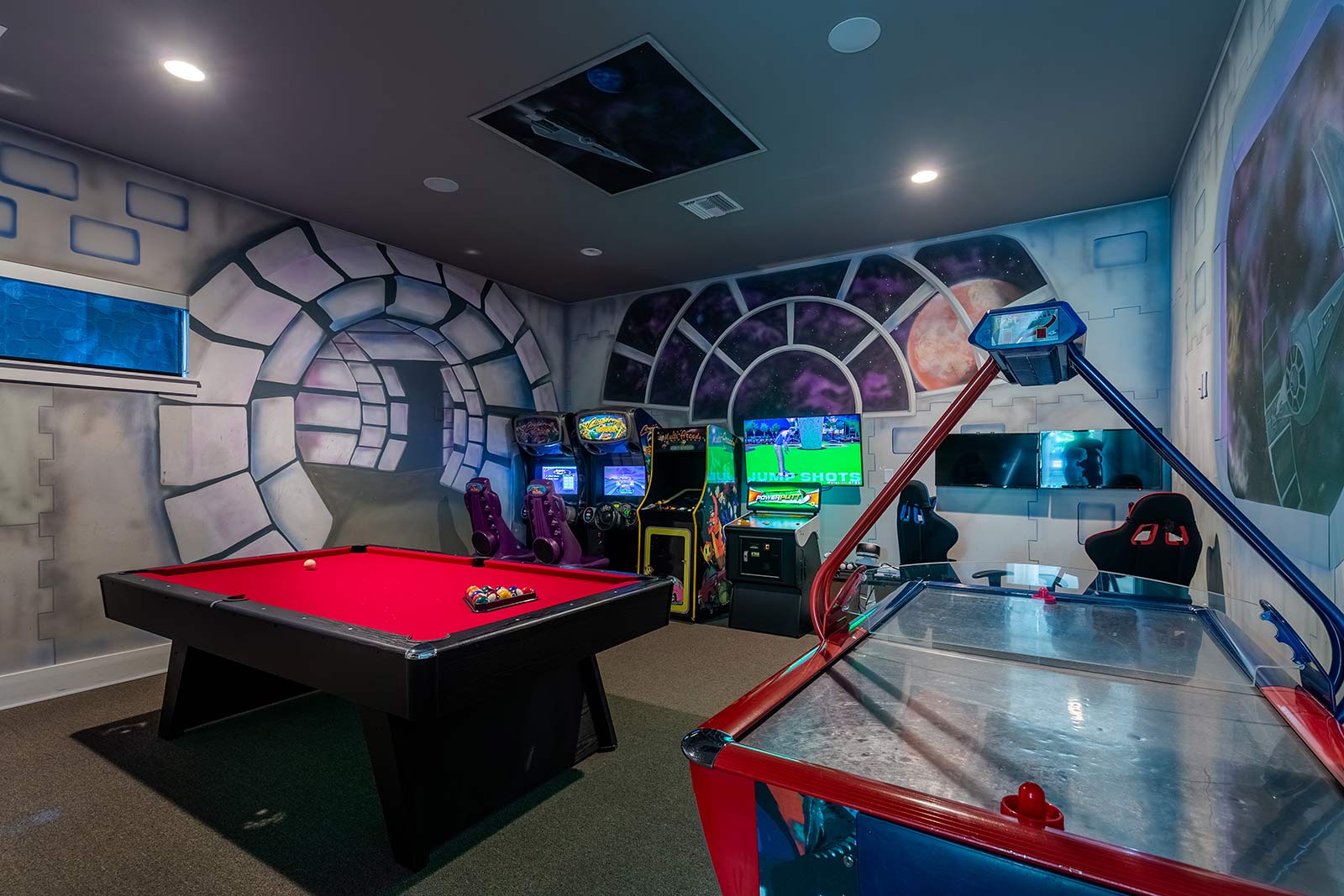 game room with arcade games, pool table, and air hockey