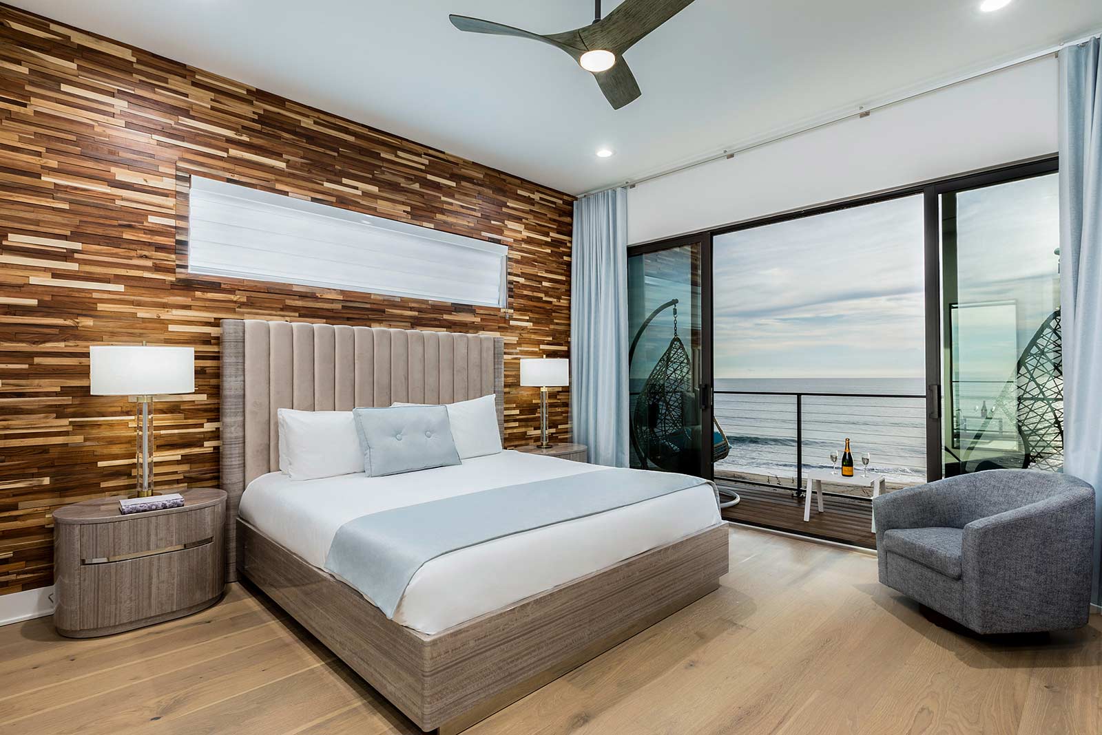 bedroom with balcony and ocean view