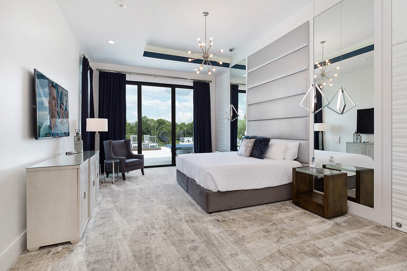 bedroom with king bed and doors to outdoor patio