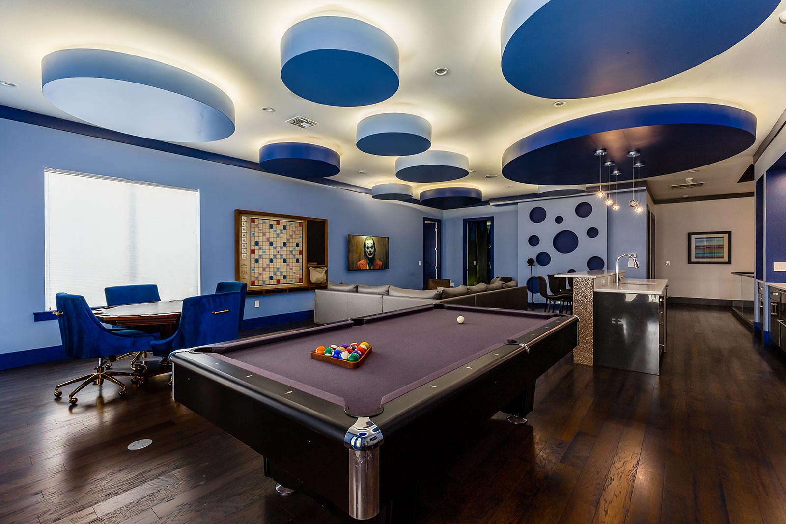 game loft with pool table and wall scrabble