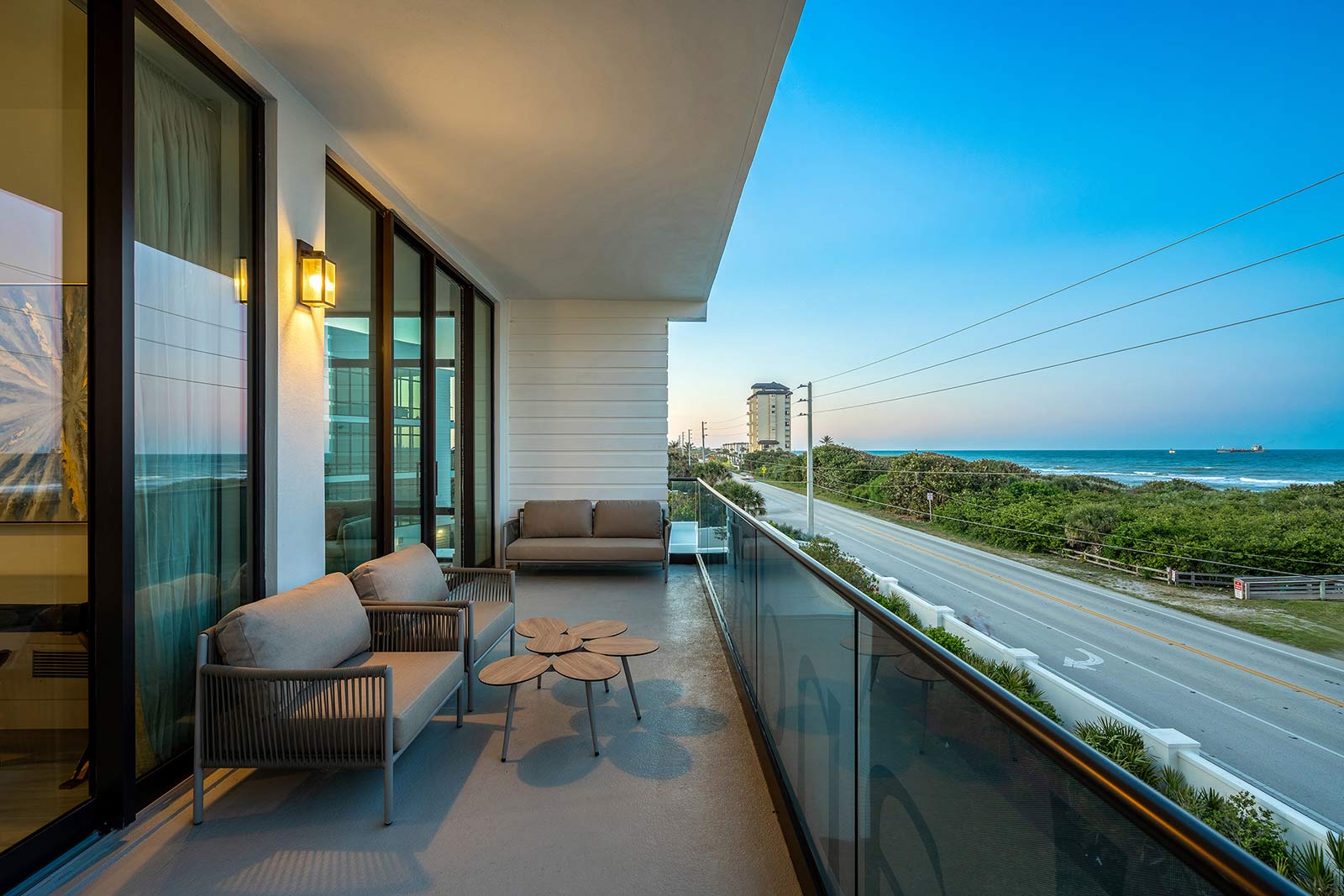 balcony with street and ocean view