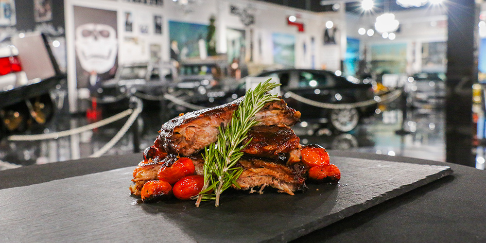 plated food in car museum event space