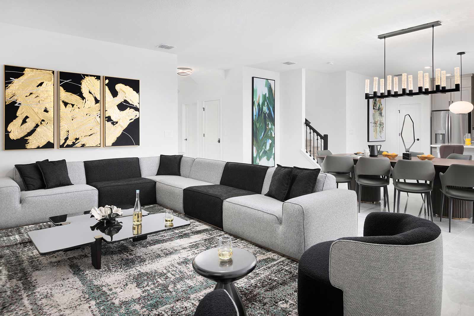 living room with black and gray l-shaped couch