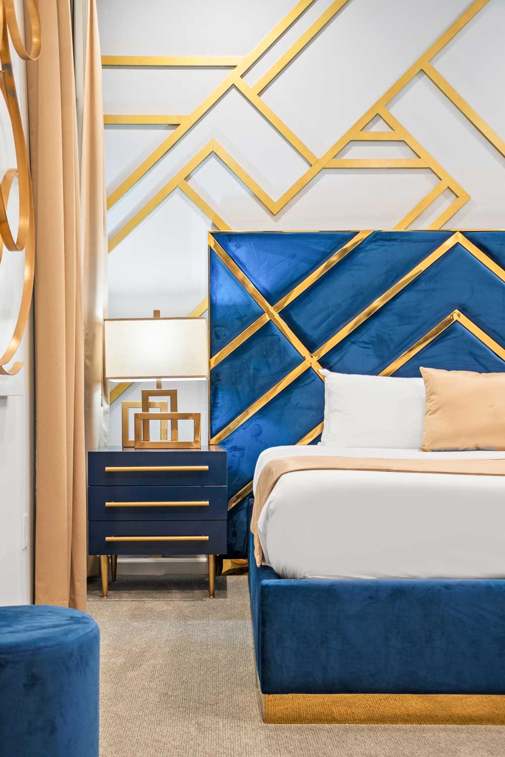 Bedroom with blue and gold patterned wall