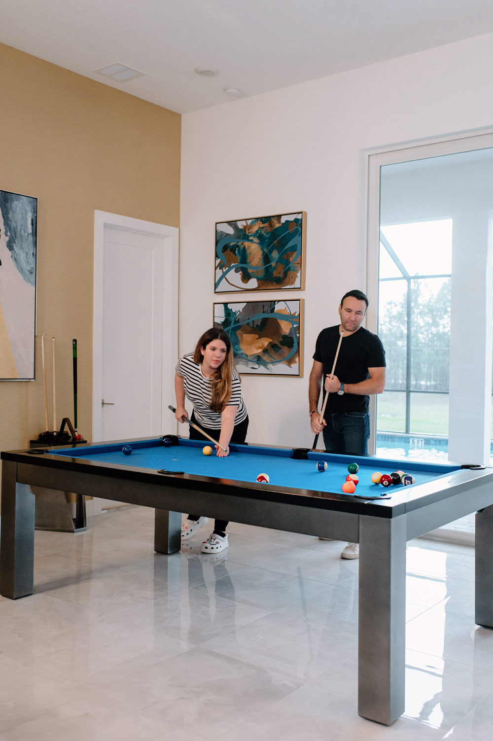two people playing pool