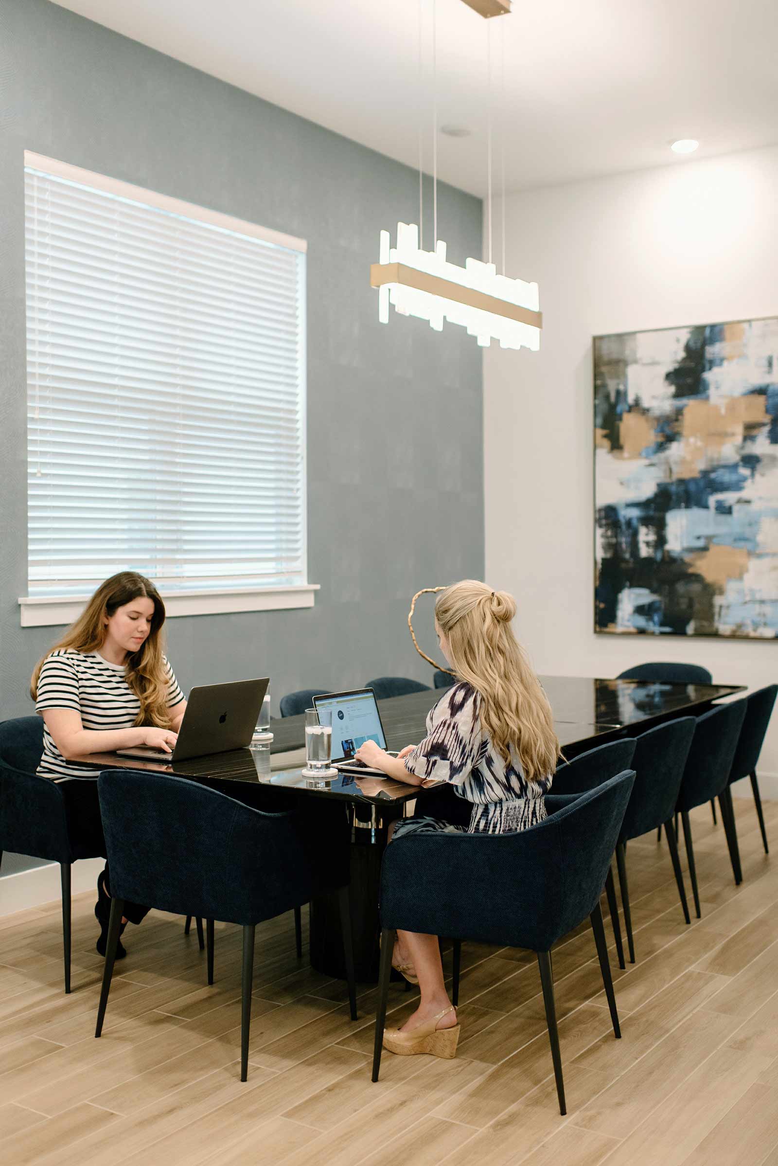 two women working at a long table