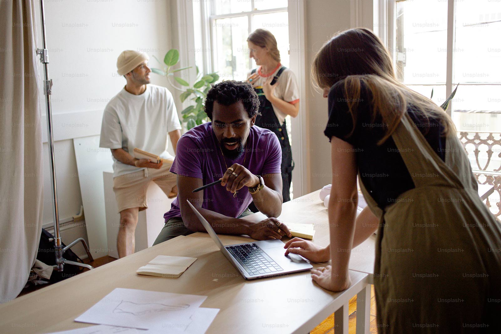 people working at a table together