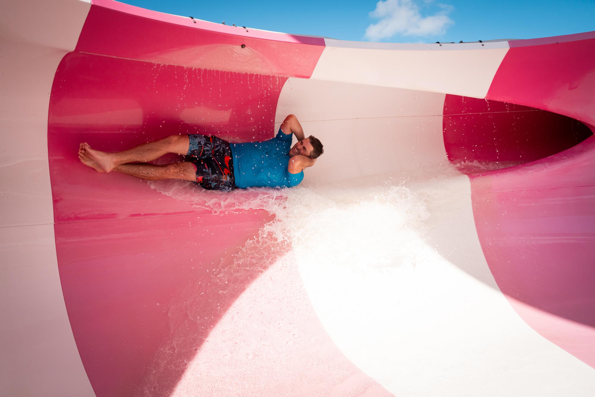 man going down a waterslide